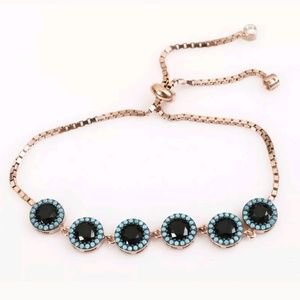 Cushion cut onyx surrounded by turquoise bracelet